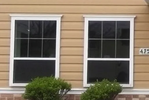 After: office windows with fogged glass and peeling casings, then clear new windows with wrapped white casings