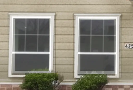 Before: office windows with fogged glass and peeling casings, then clear new windows with wrapped white casings