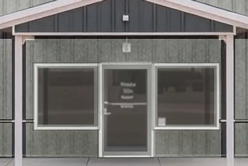 Before: metal building storefront windows